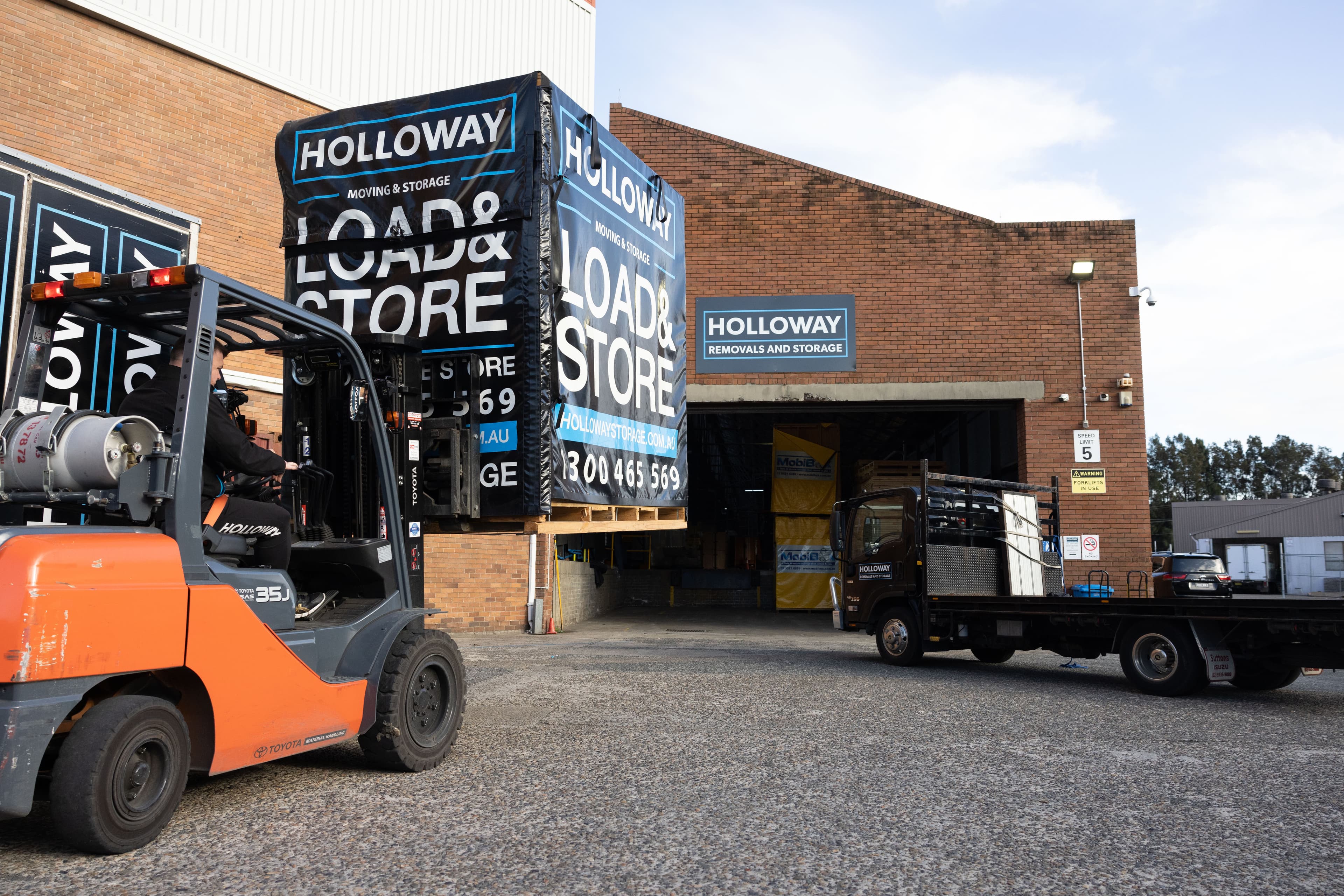 Forklift Moving Storage Modules in a Warehouse