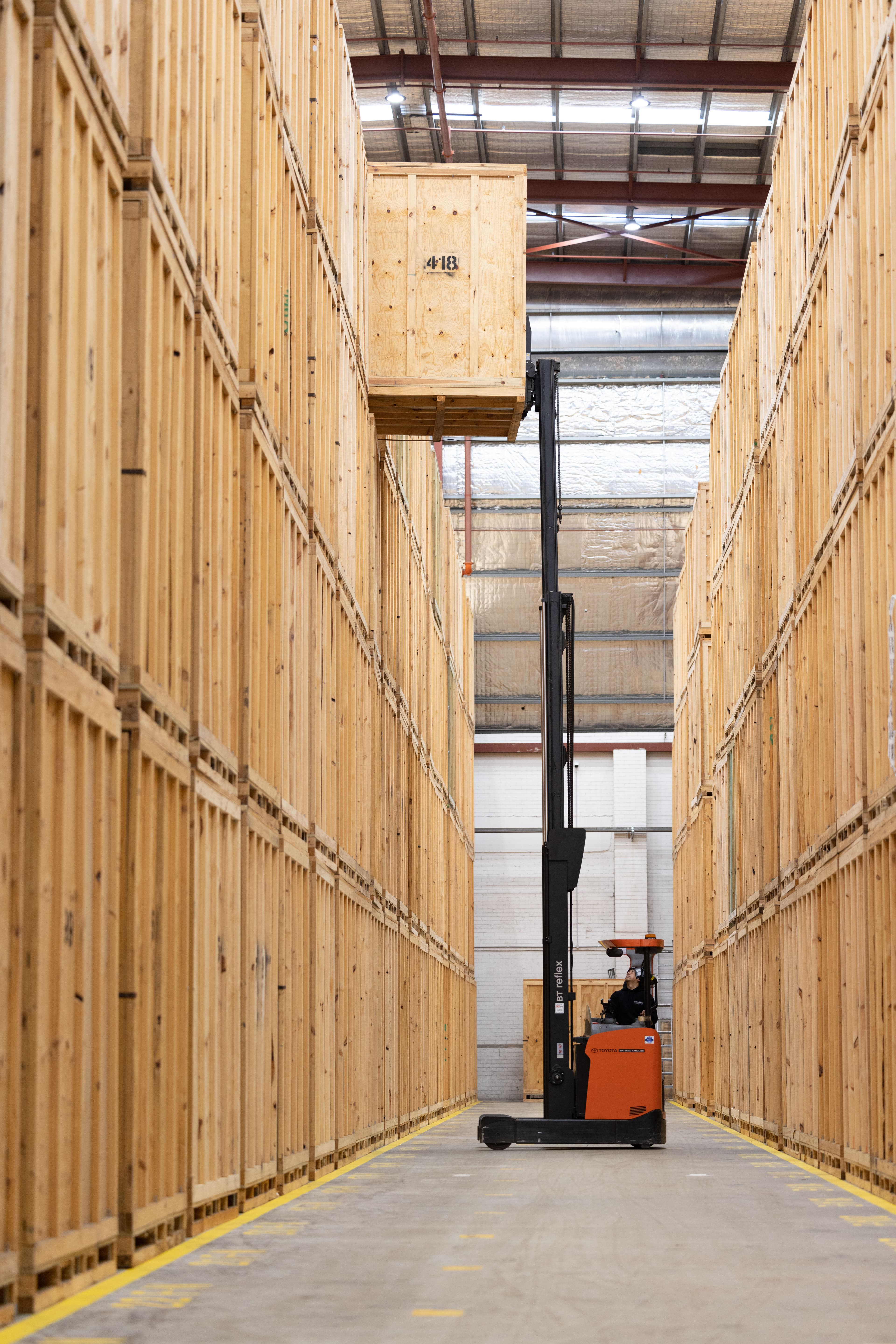 Forklift Moving Storage Modules in a Warehouse