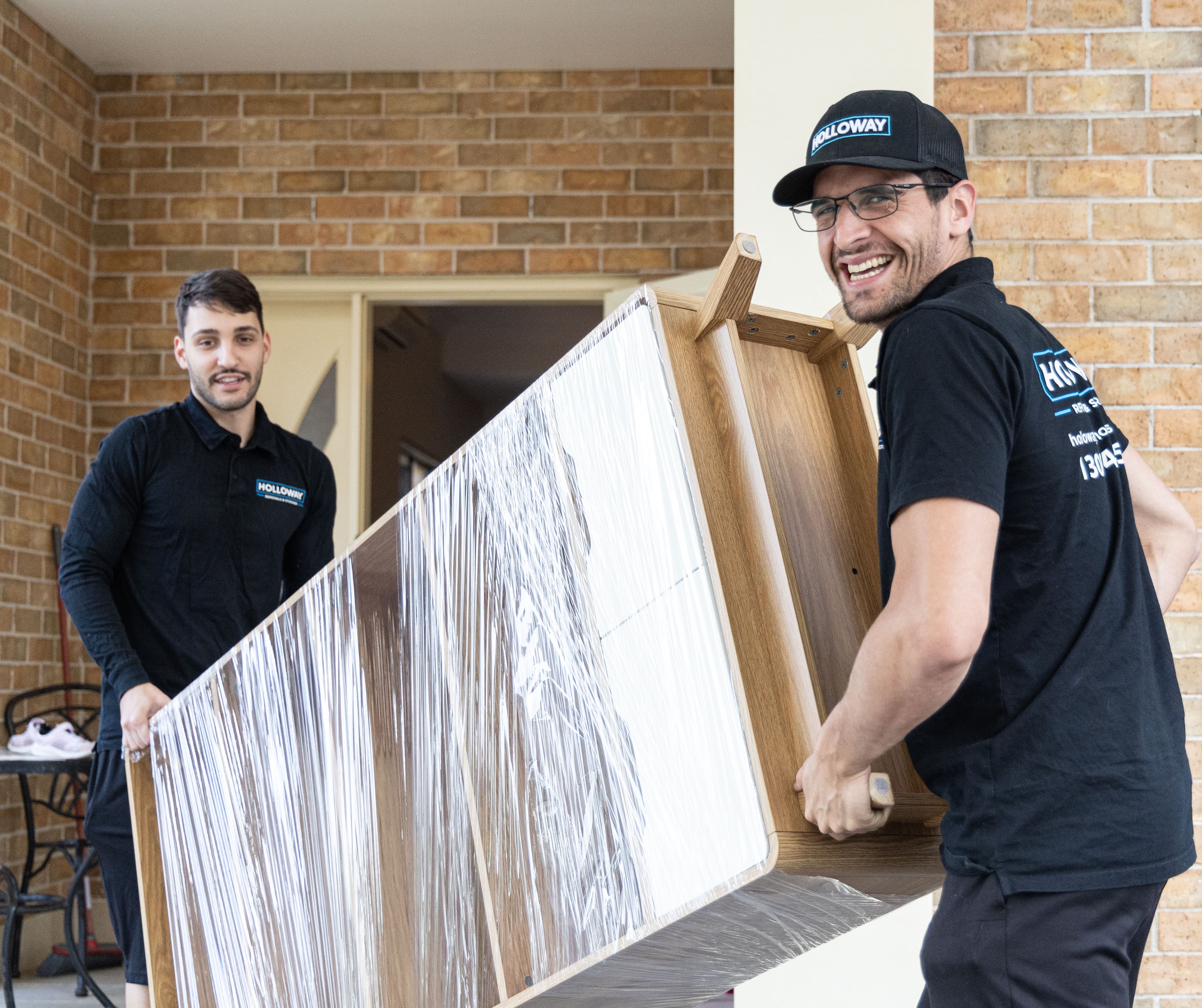 Removalists Moving Wrapped Home Items