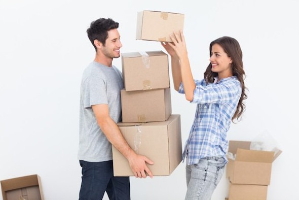 Couple Carrying Boxes to a Storage Unit